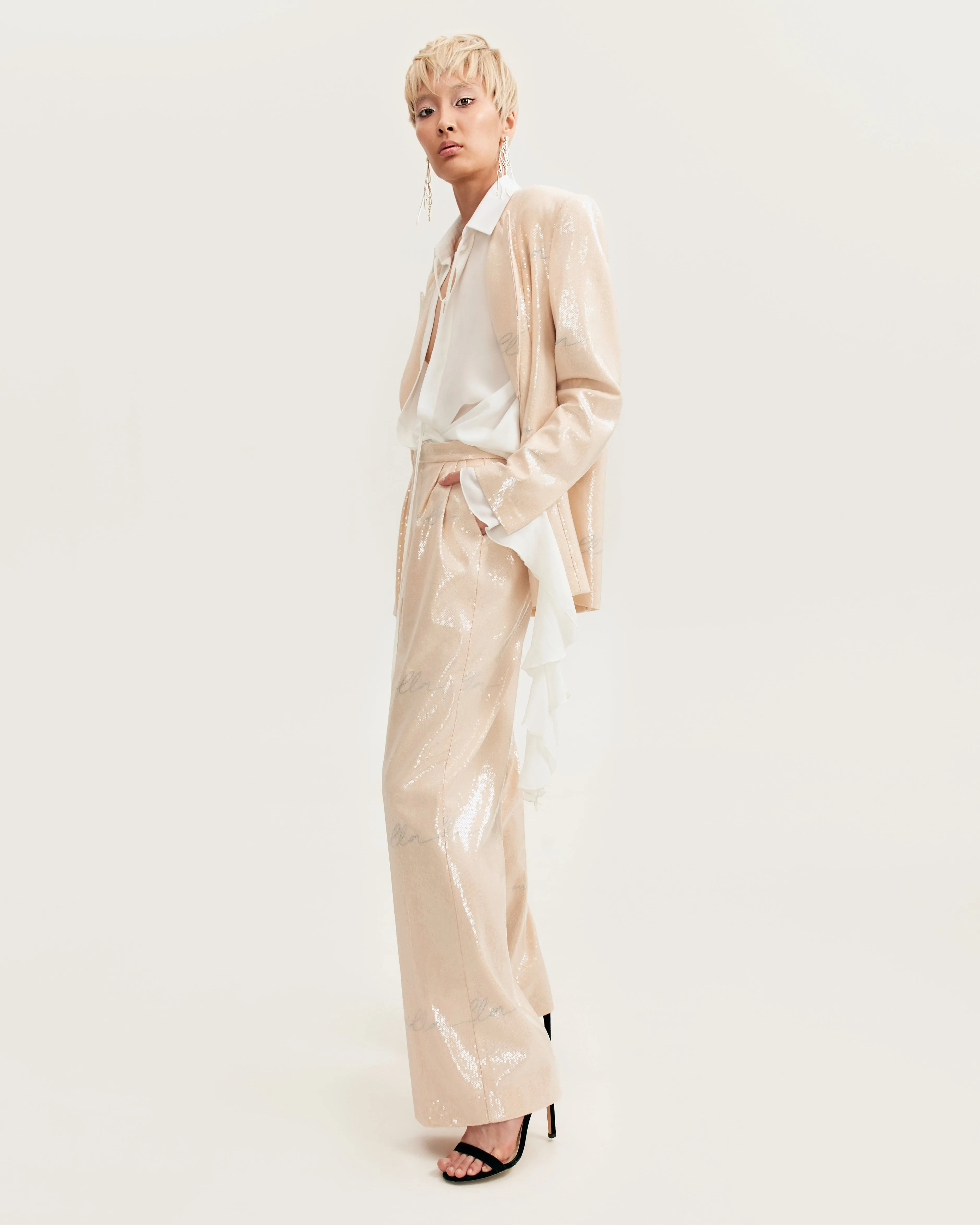 Sparkling beige trousers with Milla's signature, Xo Xo